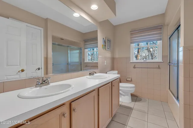 a bathroom with a sink and a large mirror