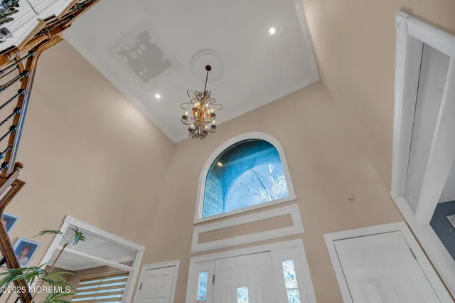 a view of a hallway with a chandelier