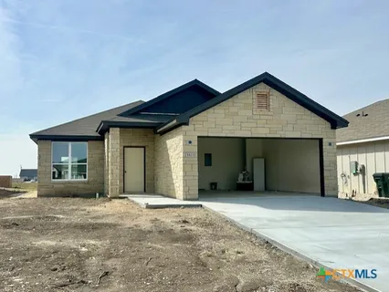 a front view of a house with a garage