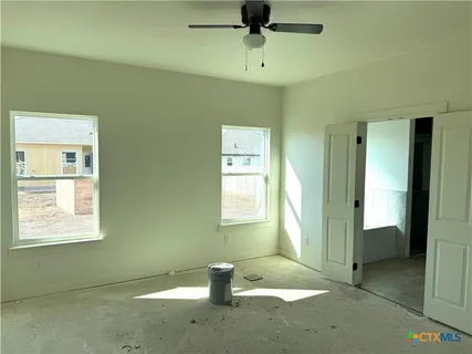 a view of an empty room with a window