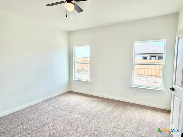 an empty room with windows