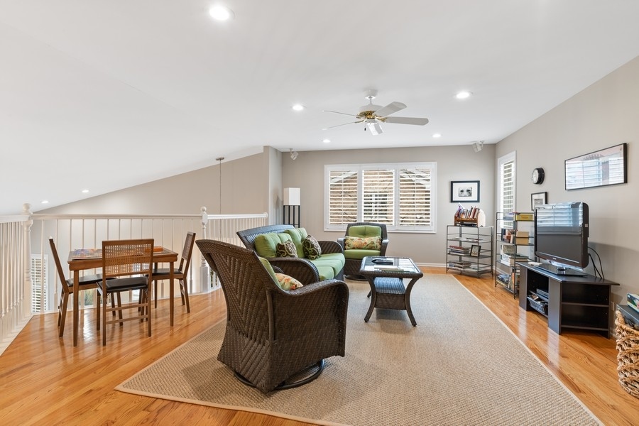 1722 Park Ridge Point Park Ridge, IL 60068 - Photo 13 of 25 a living room with furniture a fireplace and a flat screen tv