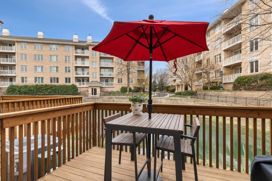 1722 Park Ridge Point Park Ridge, IL 60068 - Photo 20 of 25 a view of a balcony with wooden floor and a floor to ceiling window