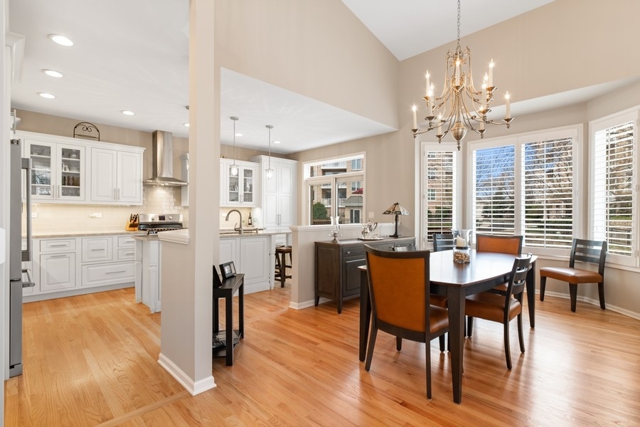 1722 Park Ridge Point Park Ridge, IL 60068 - Photo 4 of 25 a view of a dining room with furniture and wooden floor