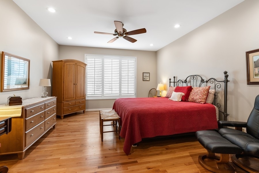 1722 Park Ridge Point Park Ridge, IL 60068 - Photo 10 of 25 a bedroom with a bed and wooden floor