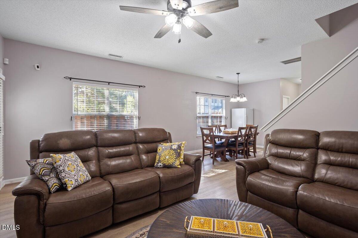 3502 Oneonta Avenue Raleigh, NC 27604 - Photo 18 of 28 a living room with furniture ceiling fan and a rug
