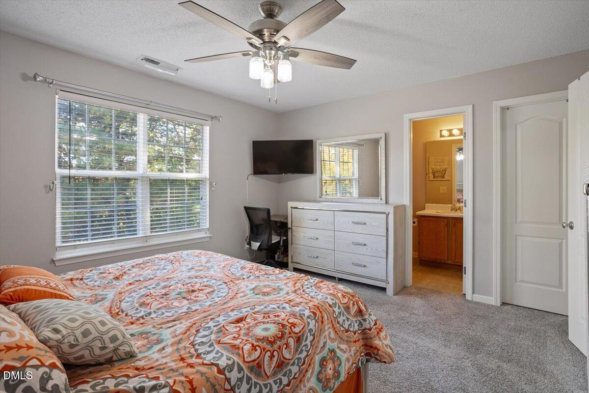 3502 Oneonta Avenue Raleigh, NC 27604 - Photo 20 of 28 a bedroom with a bed and a flat screen tv