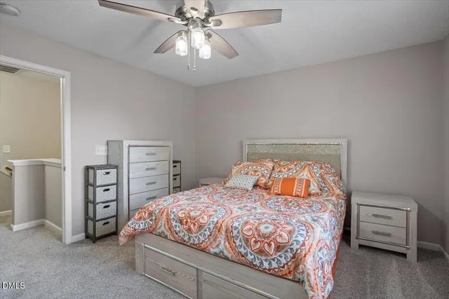 a bedroom with a bed and a view of bedroom