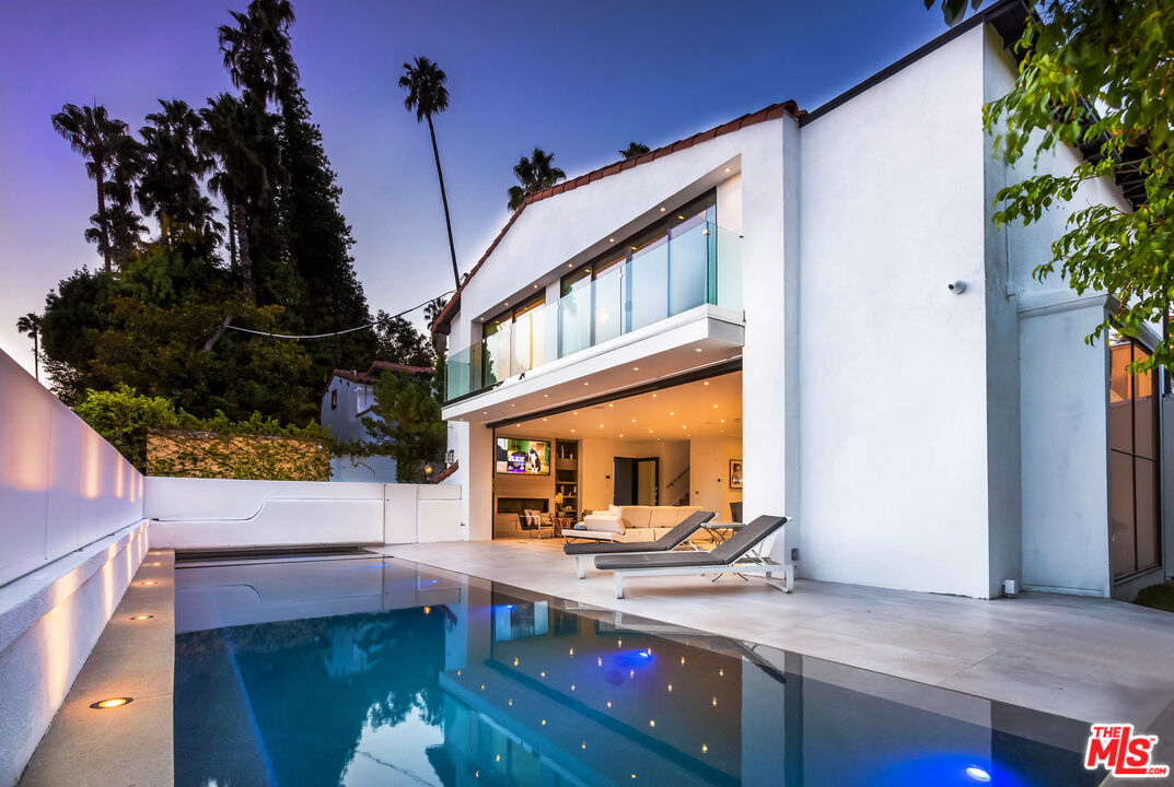 9331 Doheny Road Beverly Hills, CA 90210 - Photo 1 of 14 a view of house with a swimming pool