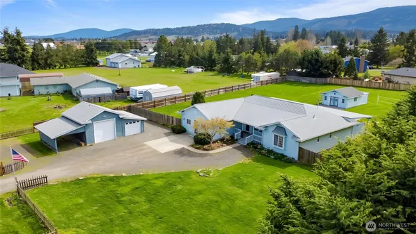 an aerial view of a house with outdoor space patio and mountain view