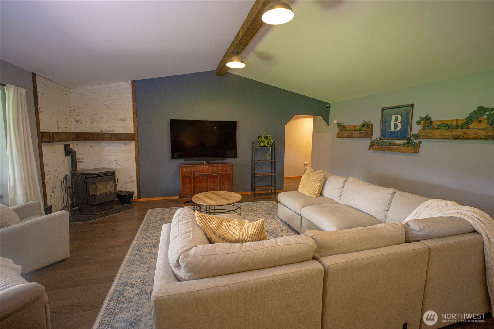 787 North Kendall Road Sequim, WA 98382 - Photo 13 of 40 a living room with furniture and a flat screen tv