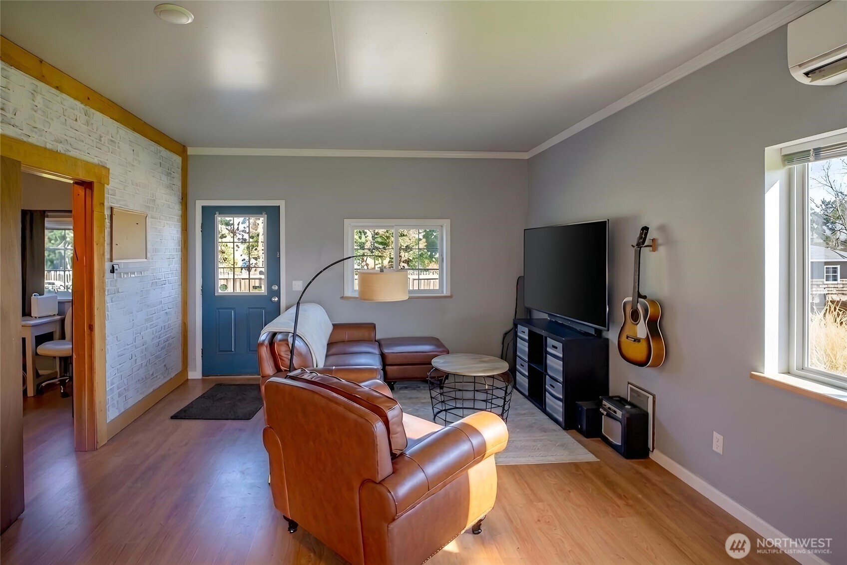 787 North Kendall Road Sequim, WA 98382 - Photo 24 of 40 a living room with furniture and a flat screen tv with wooden floor