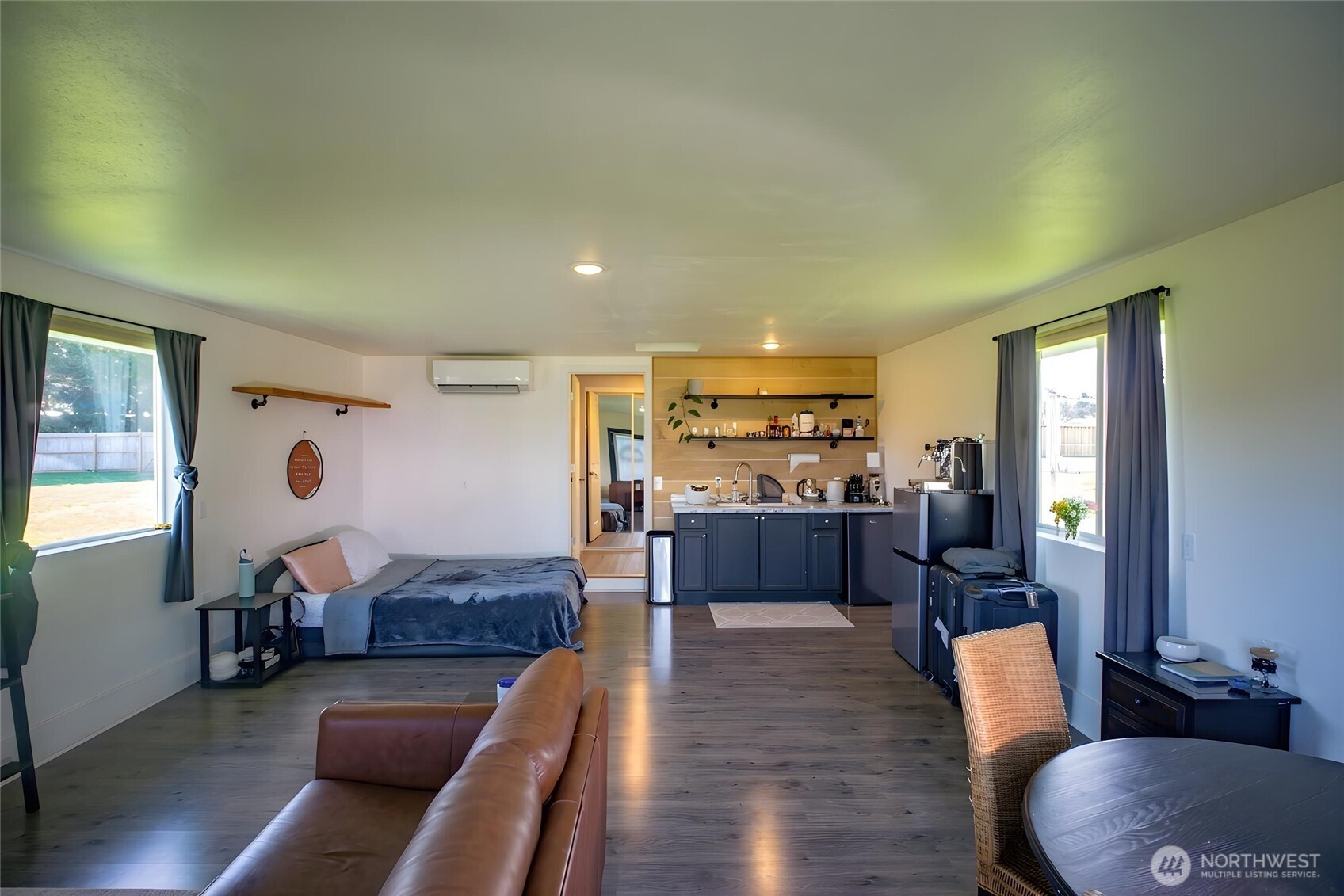 787 North Kendall Road Sequim, WA 98382 - Photo 30 of 40 a living room with furniture and a wooden floor