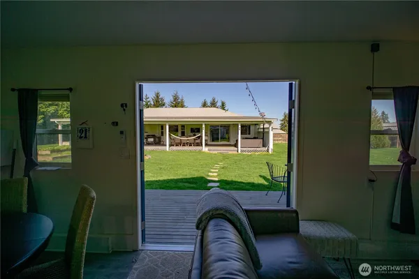 a front view of a house with a yard table and chairs