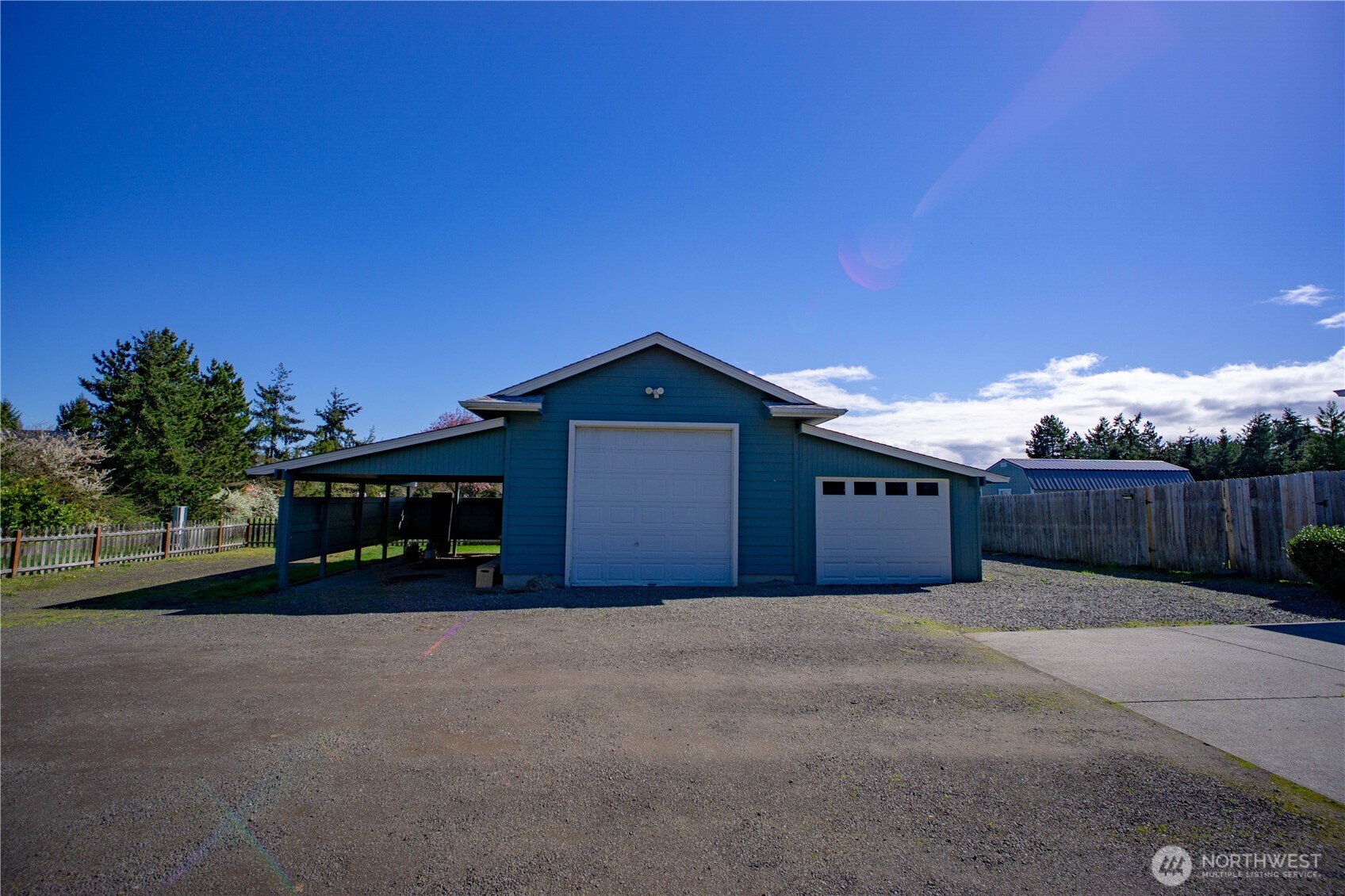 787 North Kendall Road Sequim, WA 98382 - Photo 36 of 40 a front view of a house with a yard and garage