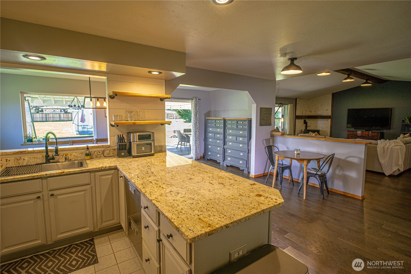 787 North Kendall Road Sequim, WA 98382 - Photo 8 of 40 a kitchen with a sink appliances and wooden floor