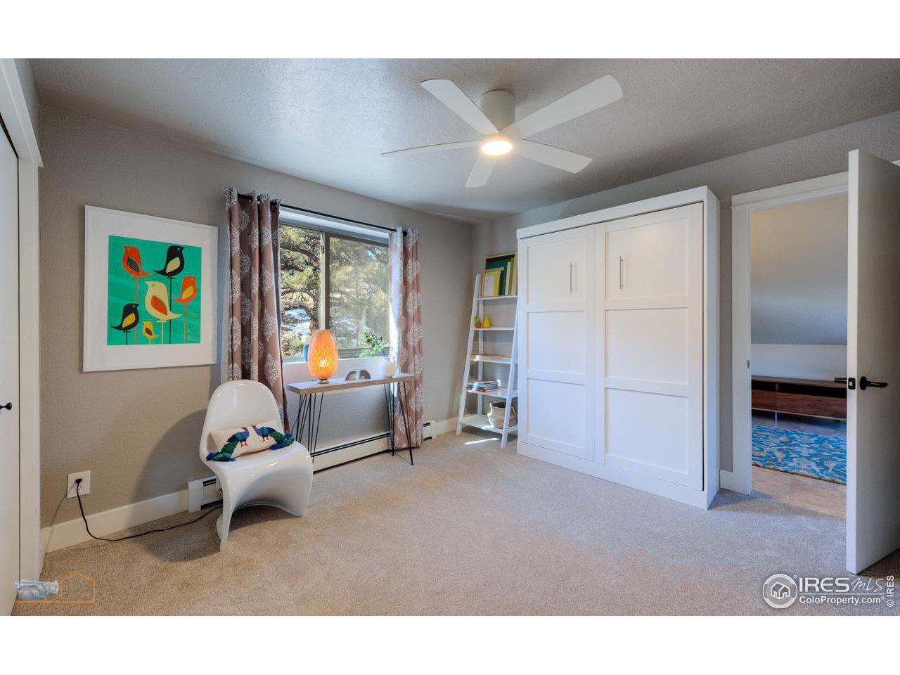 8323 West Fork Road Boulder, CO 80302 - Photo 28 of 36 a living room with furniture and a window