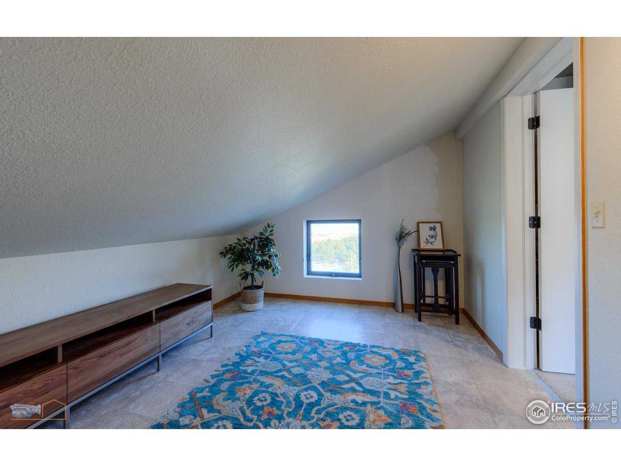 8323 West Fork Road Boulder, CO 80302 - Photo 29 of 36 a living room with furniture and a window