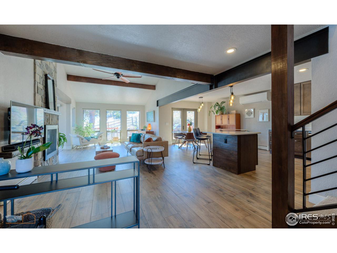 8323 West Fork Road Boulder, CO 80302 - Photo 5 of 36 a living room with furniture and a flat screen tv