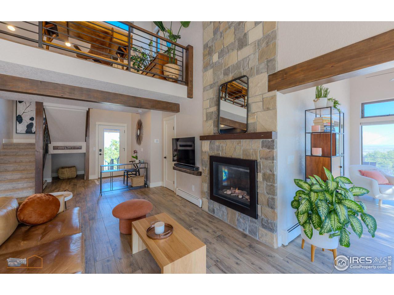 8323 West Fork Road Boulder, CO 80302 - Photo 6 of 36 a living room with furniture and a fireplace
