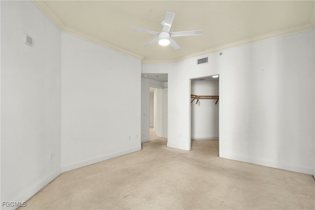2743 First Street, Unit 1006 Fort Myers, FL 33916 - Photo 28 of 38 a view of an empty room with a ceiling fan