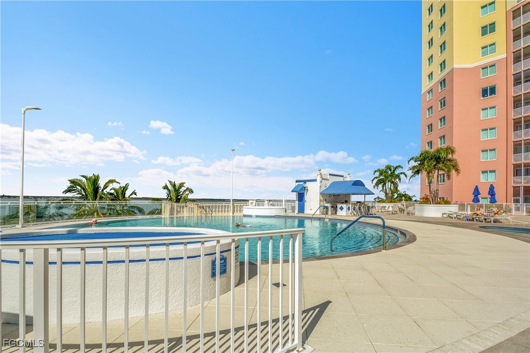 2743 First Street, Unit 1006 Fort Myers, FL 33916 - Photo 35 of 38 a view of a swimming pool with a patio