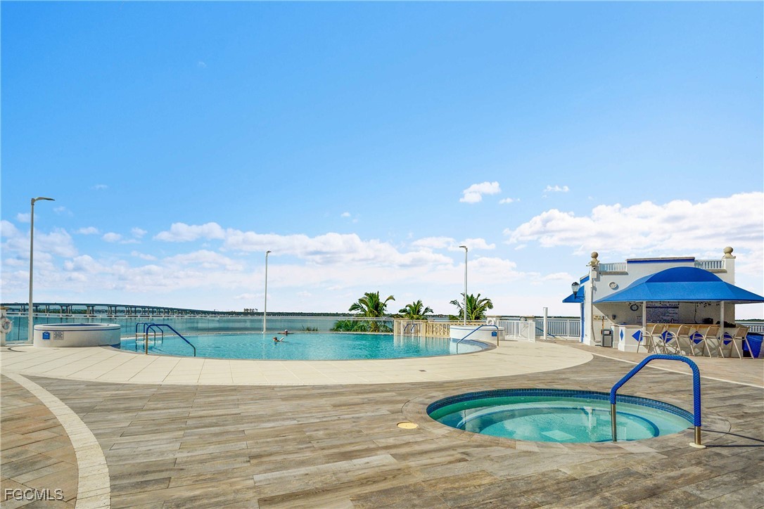 2743 First Street, Unit 1006 Fort Myers, FL 33916 - Photo 4 of 38 a table and chairs in the patio