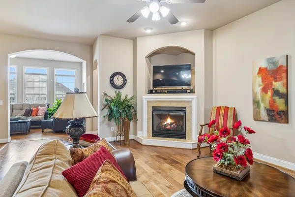 a living room with furniture and a fireplace