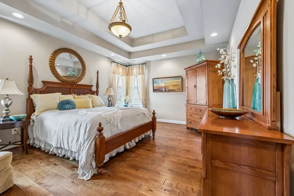 a bedroom with a large bed and a large window