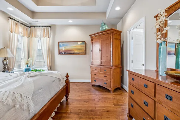 a bed room with a bed and a dresser