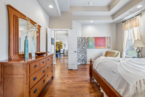 a bedroom with bed and window