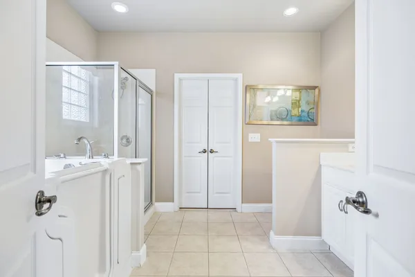 a bathroom with a bathtub and shower