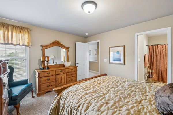 a bedroom with a bed and furniture