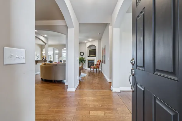 a view of a living room with a fireplace
