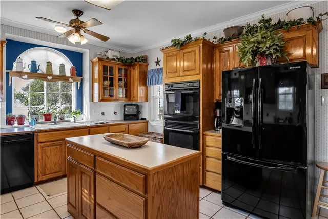 a kitchen that has a lot of cabinets in it
