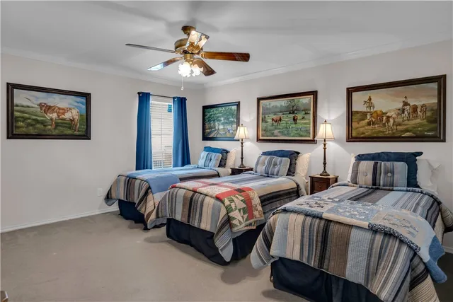 a spacious bedroom with a bed and a painting on the wall