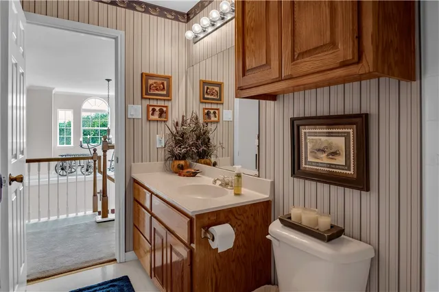 a view of a hallway with furniture and front door