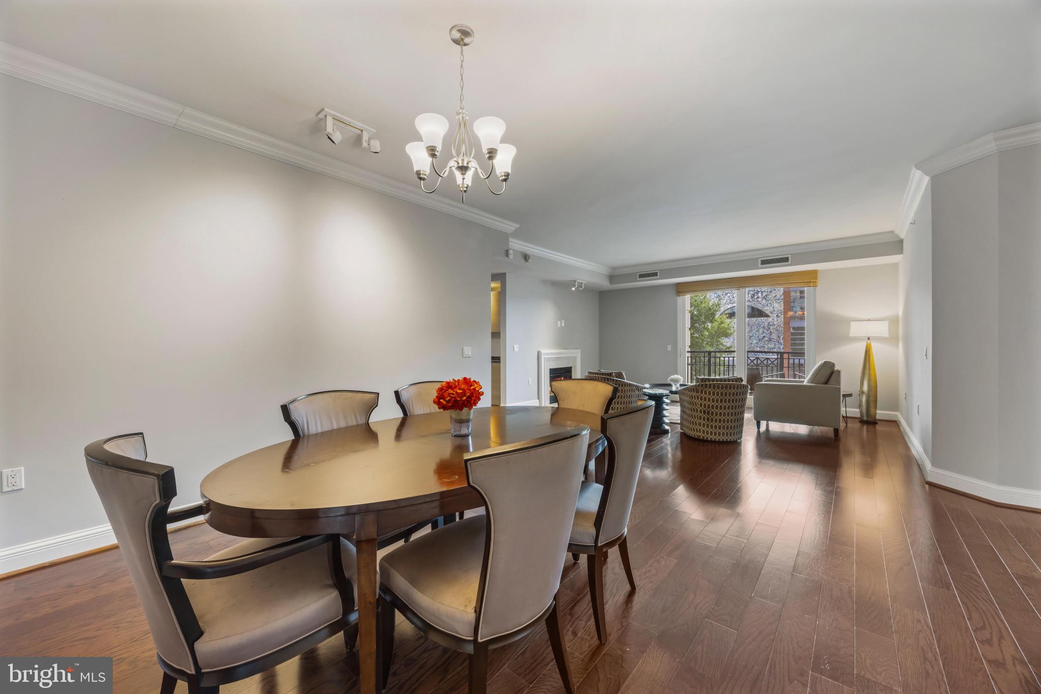 801 Key Highway, Unit 323 Baltimore, MD 21230 - Photo 18 of 56 a view of a dining room with furniture window and wooden floor
