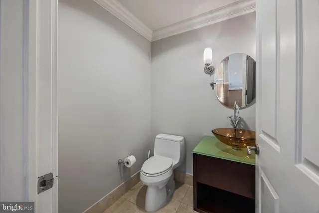 a bed room with a bed and a chair