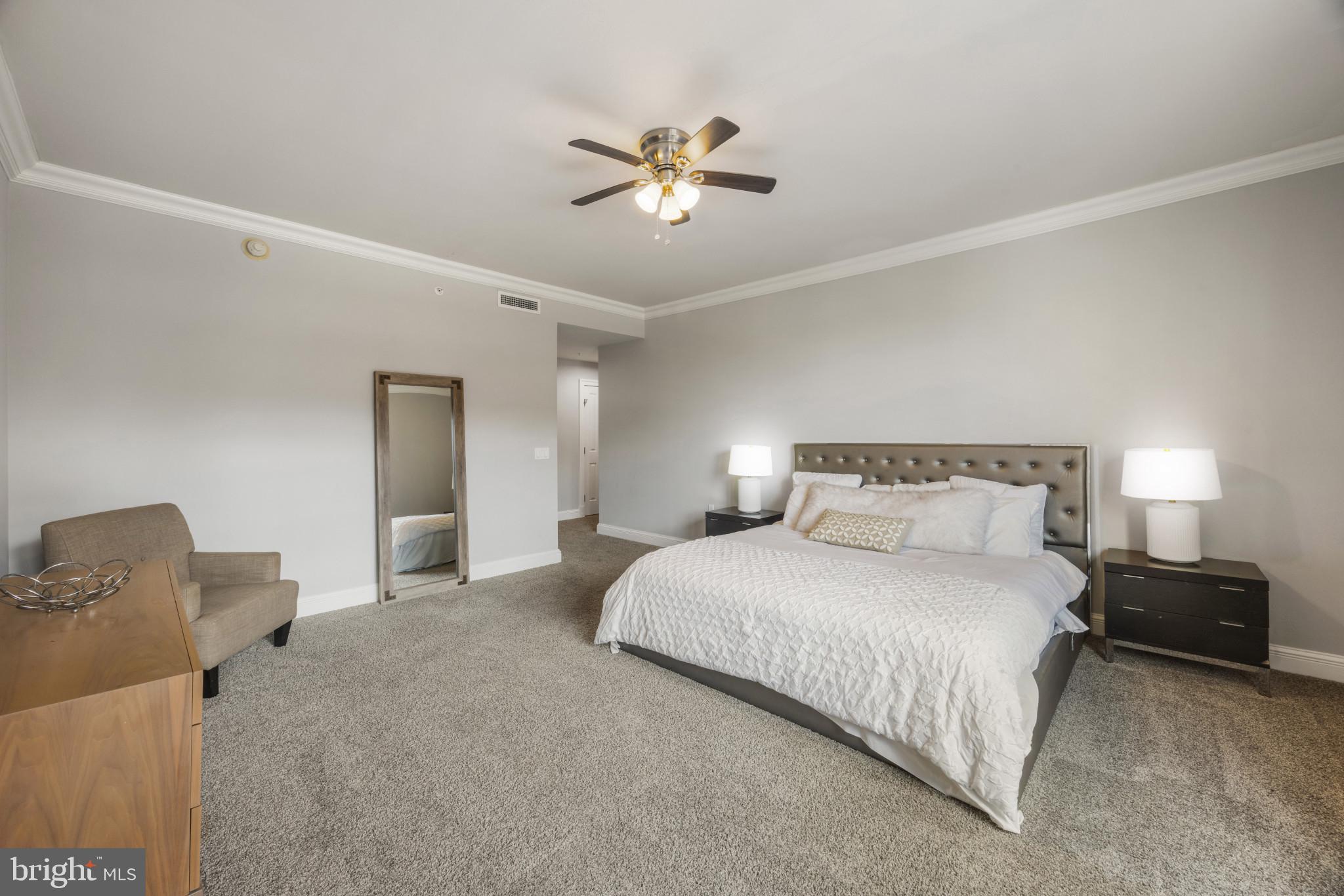 801 Key Highway, Unit 323 Baltimore, MD 21230 - Photo 25 of 56 a bedroom with a bed and window