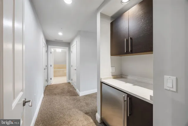 a spacious bathroom with a tub a sink shower double vanity and a mirror