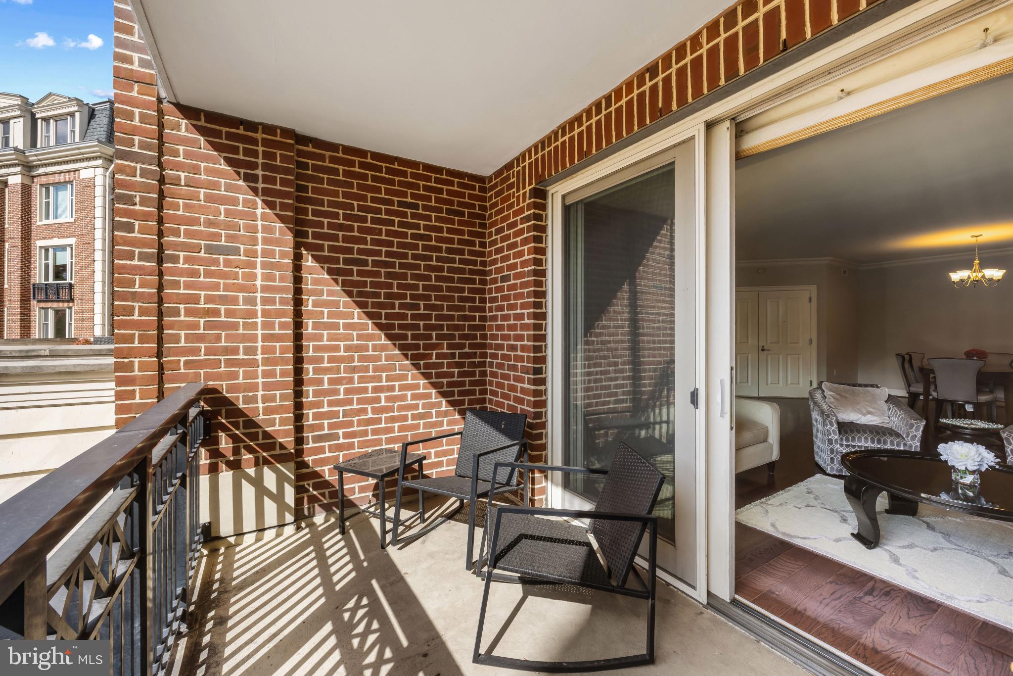 801 Key Highway, Unit 323 Baltimore, MD 21230 - Photo 40 of 56 a balcony view with a couple of chairs and a table