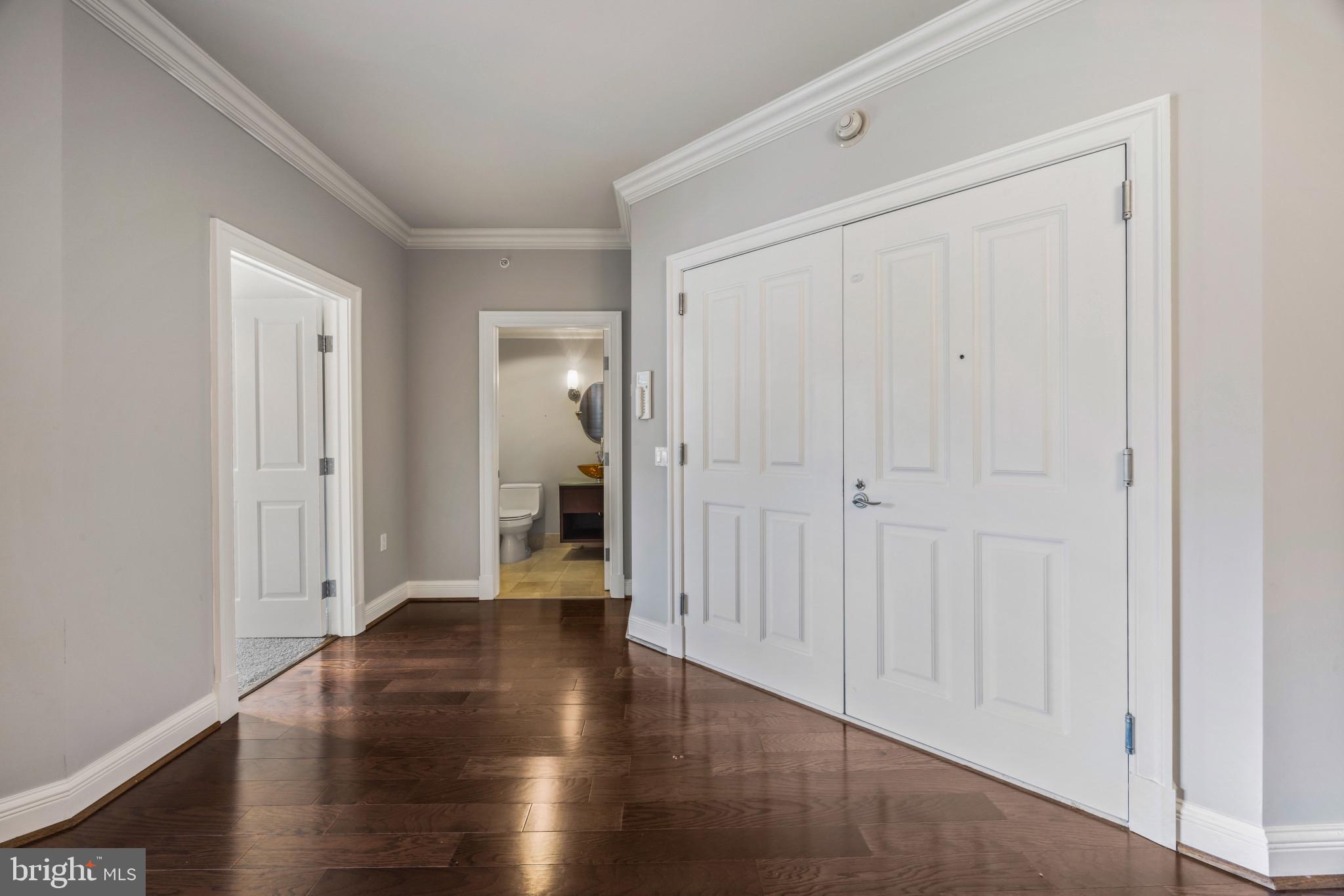 801 Key Highway, Unit 323 Baltimore, MD 21230 - Photo 4 of 56 a view of a hallway with wooden floor