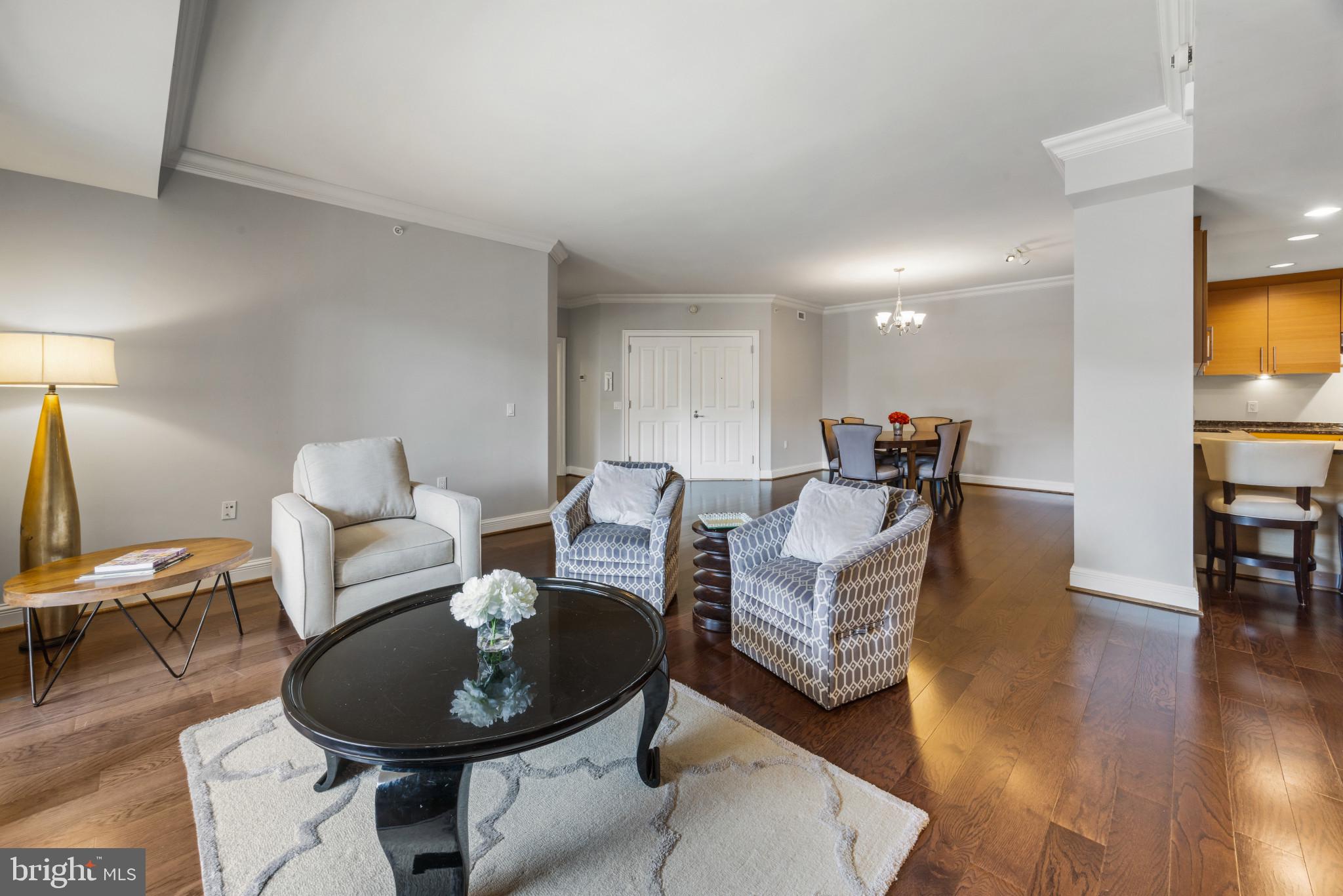 801 Key Highway, Unit 323 Baltimore, MD 21230 - Photo 7 of 56 a living room with furniture a wooden floor and a piano