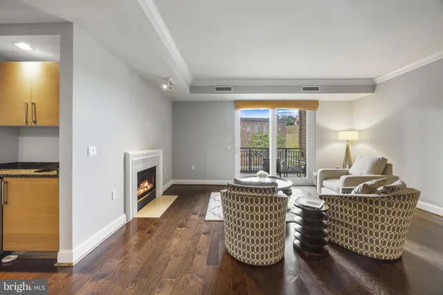 a kitchen with a table chairs and a refrigerator