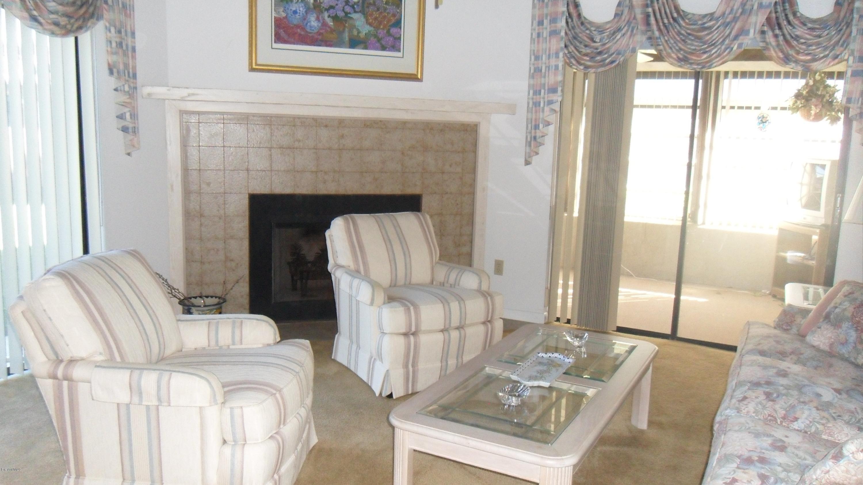 407 Myrtlewood Road Melbourne, FL 32940 - Photo 11 of 31 Family Room with Fireplace
