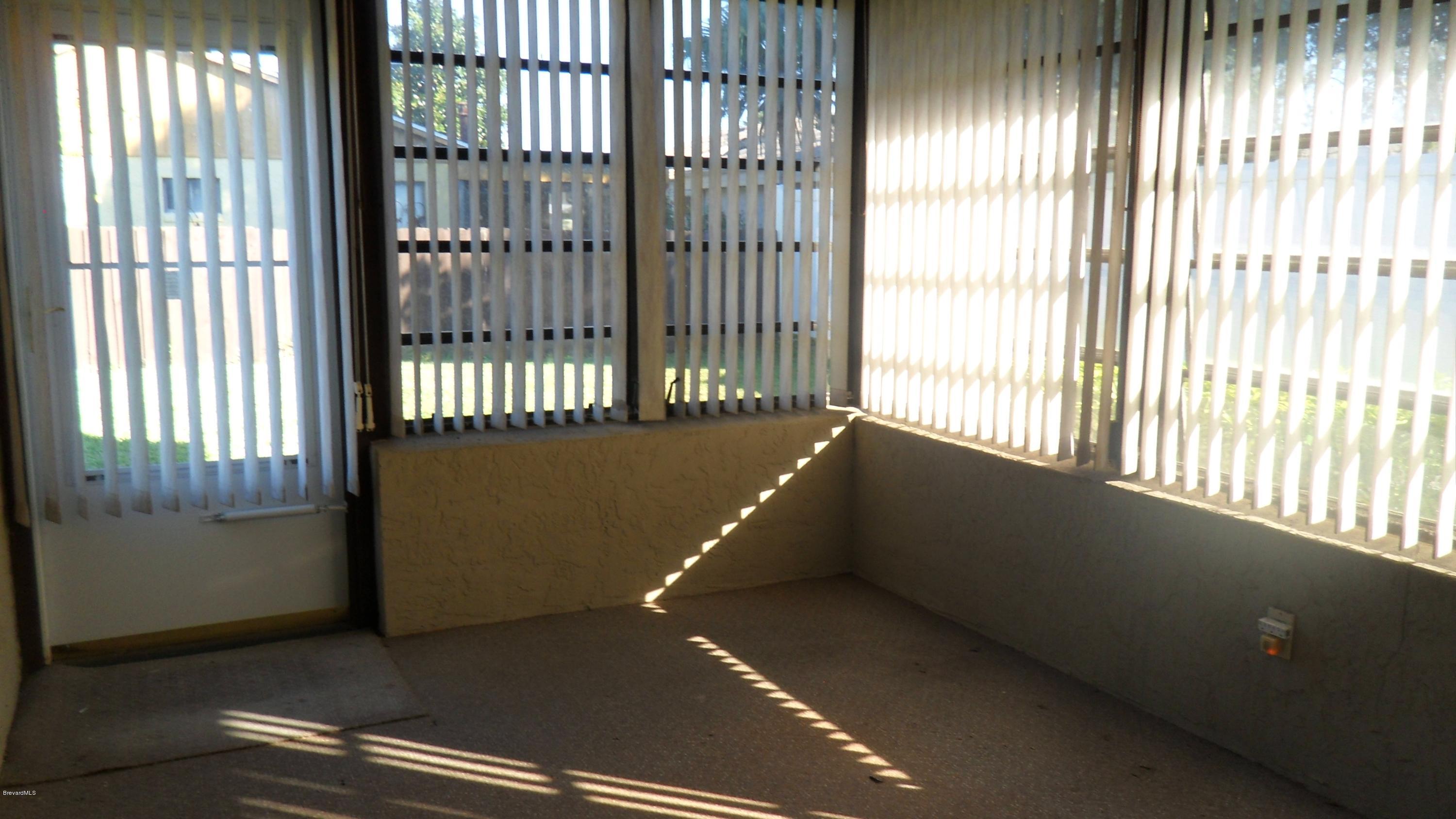 407 Myrtlewood Road Melbourne, FL 32940 - Photo 14 of 31 Screened in Florida Room