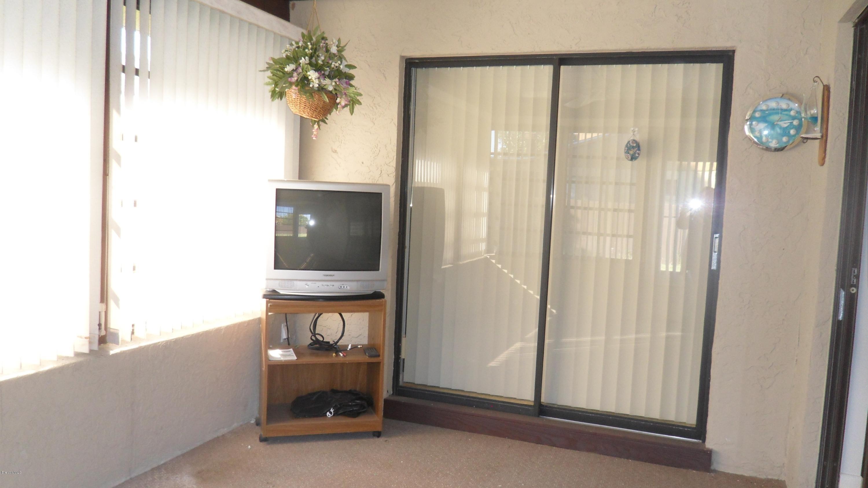 407 Myrtlewood Road Melbourne, FL 32940 - Photo 15 of 31 Screened in Florida Room
