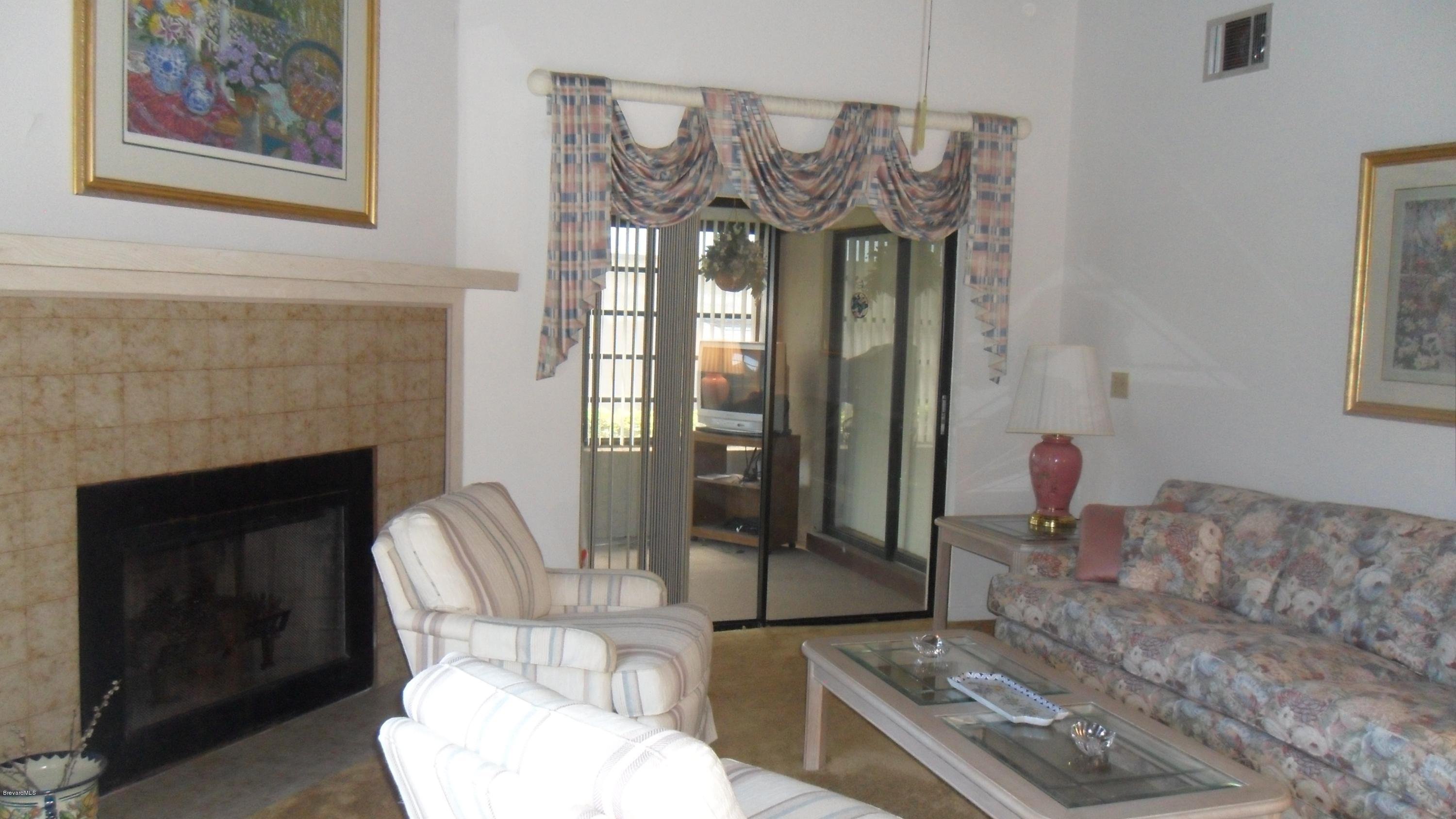 407 Myrtlewood Road Melbourne, FL 32940 - Photo 6 of 31 Family Room with Fireplace