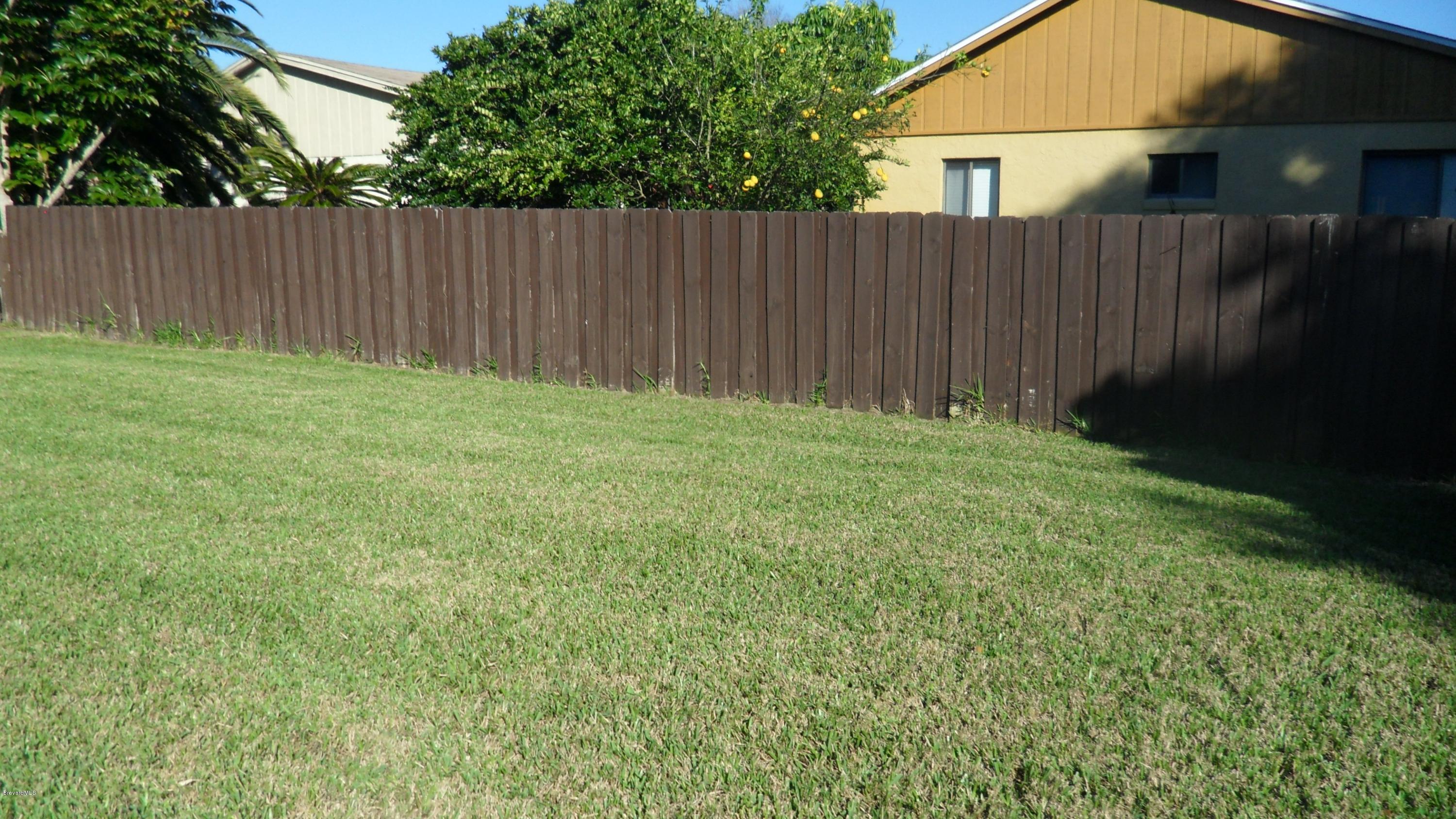 407 Myrtlewood Road Melbourne, FL 32940 - Photo 9 of 31 Partially fenced Backyard